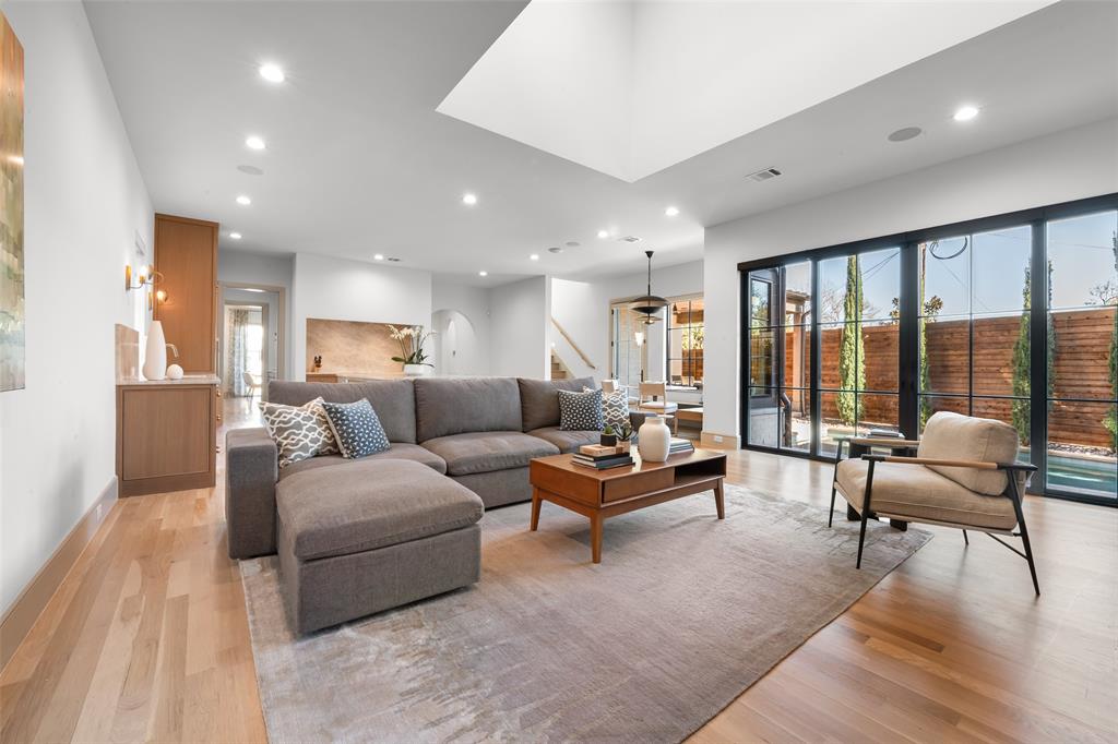 7158 Pasadena Avenue Dallas, TX 75214 - Photo 6 of 39 Living room featuring light wood-style floors and recessed lighting