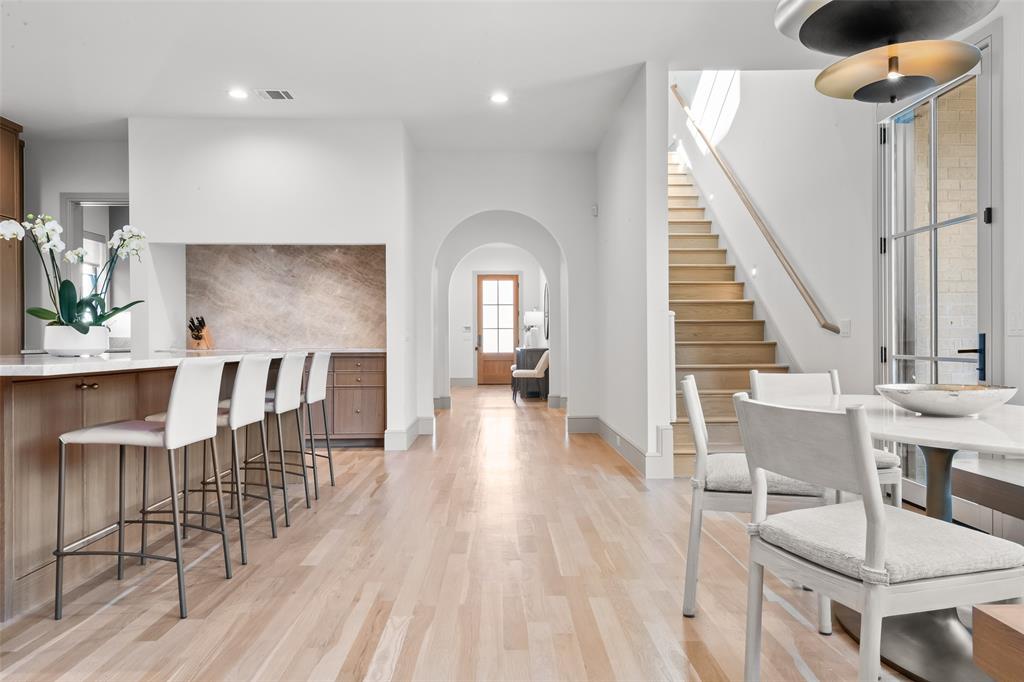 7158 Pasadena Avenue Dallas, TX 75214 - Photo 9 of 39 Dining area featuring light wood-type flooring, arched walkways, and recessed lighting