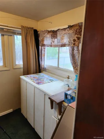 a view of a house with a tree tree and a yard