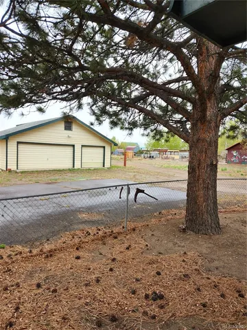a view of closet with wooden floor