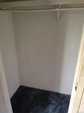 a view of hallway with wooden floor