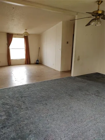 a kitchen with stainless steel appliances granite countertop a stove top oven a sink dishwasher and a refrigerator