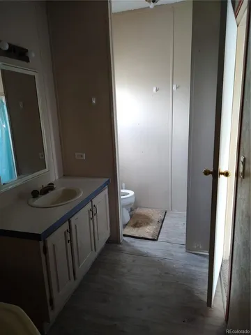 a bathroom with a toilet and a sink