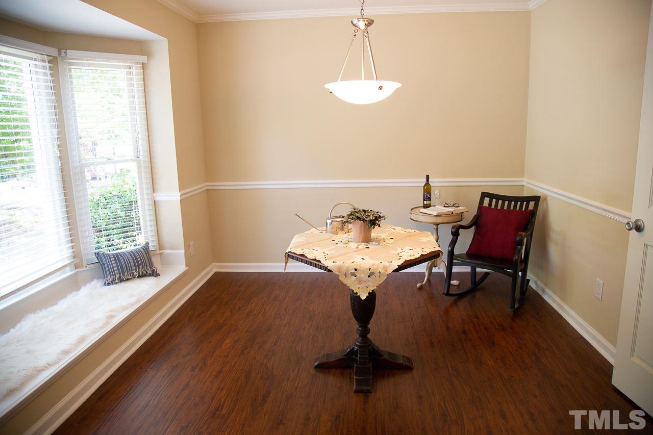 5613 Hamstead Crossing Raleigh, NC 27612 - Photo 3 of 20 a view of a dining room with furniture window and outside view