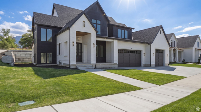 1682 North 1950 W Street, Unit 9 Provo, UT 84604 - Photo 5 of 84 Modern two-story residence featuring a striking black and white exterior with diverse textures