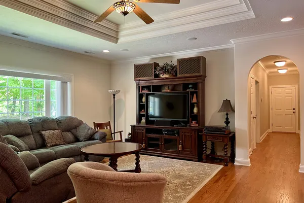 a bedroom with a bed and dresser with mirror