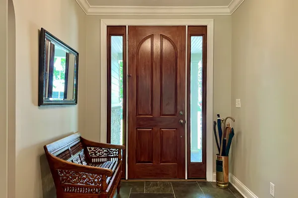 a living room with furniture and a gate