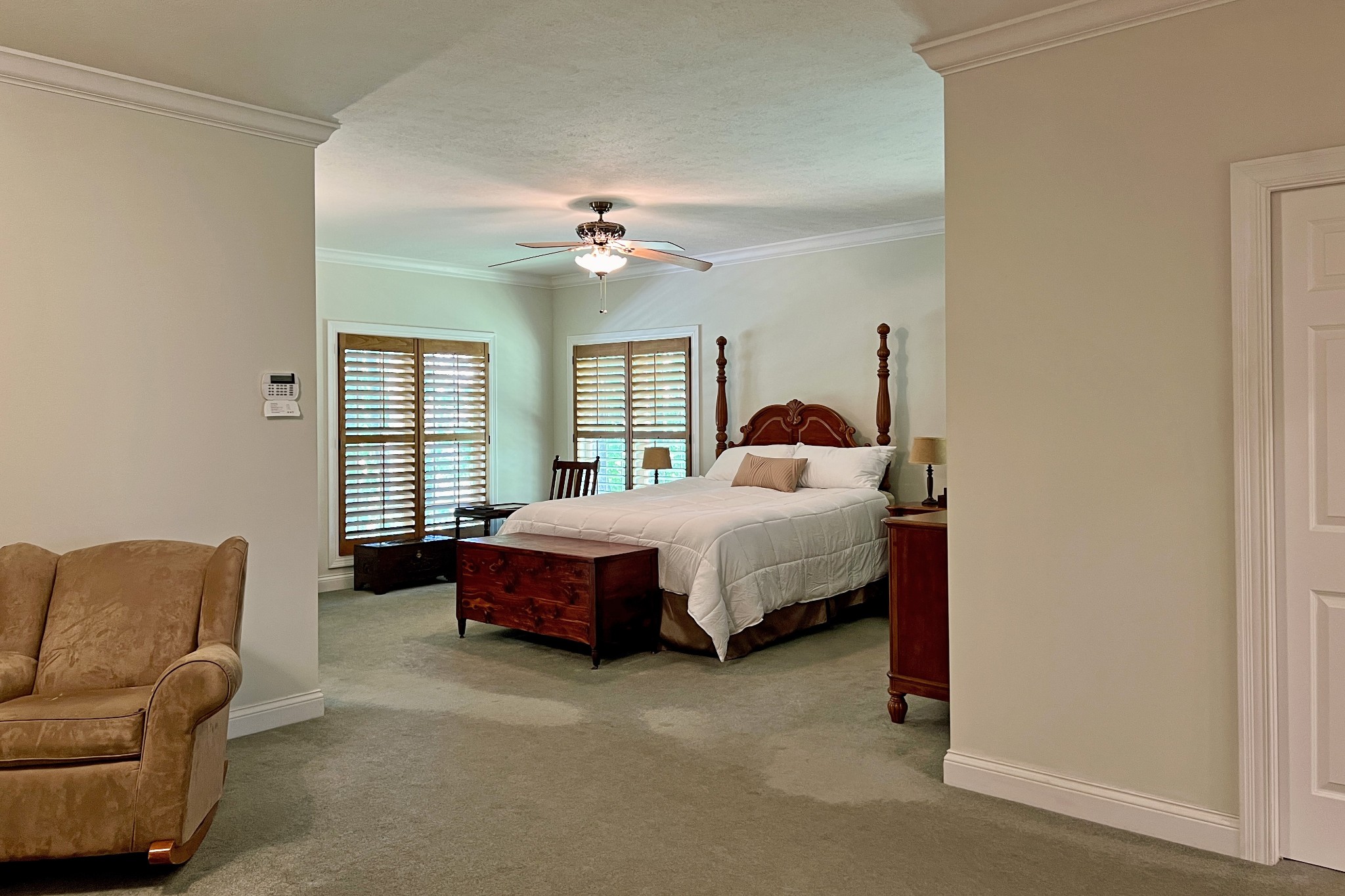 1371 Johns Loop Road Franklin, KY 42134 - Photo 21 of 72 a spacious bedroom with a bed a couch and a window