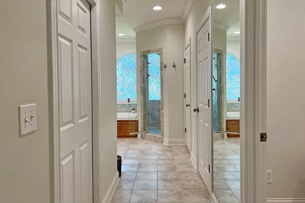 a view of walk in closet with clothes