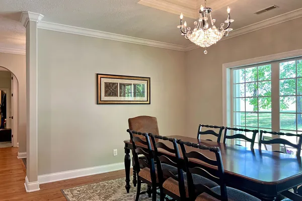 a kitchen with stainless steel appliances granite countertop a refrigerator a stove and a sink