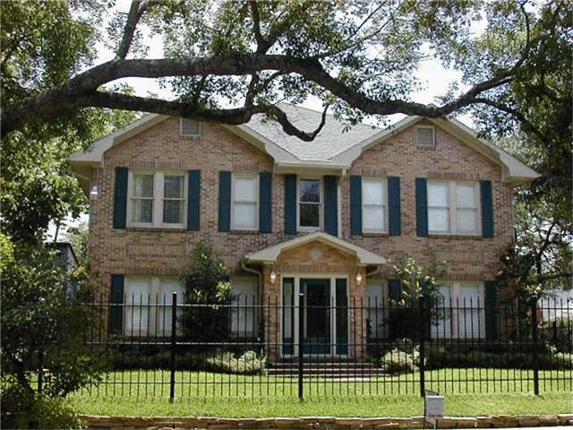 1661 Kipling Street, Unit 2 Houston, TX 77006 - Photo 10 of 10 a front view of a house with a garden and plants