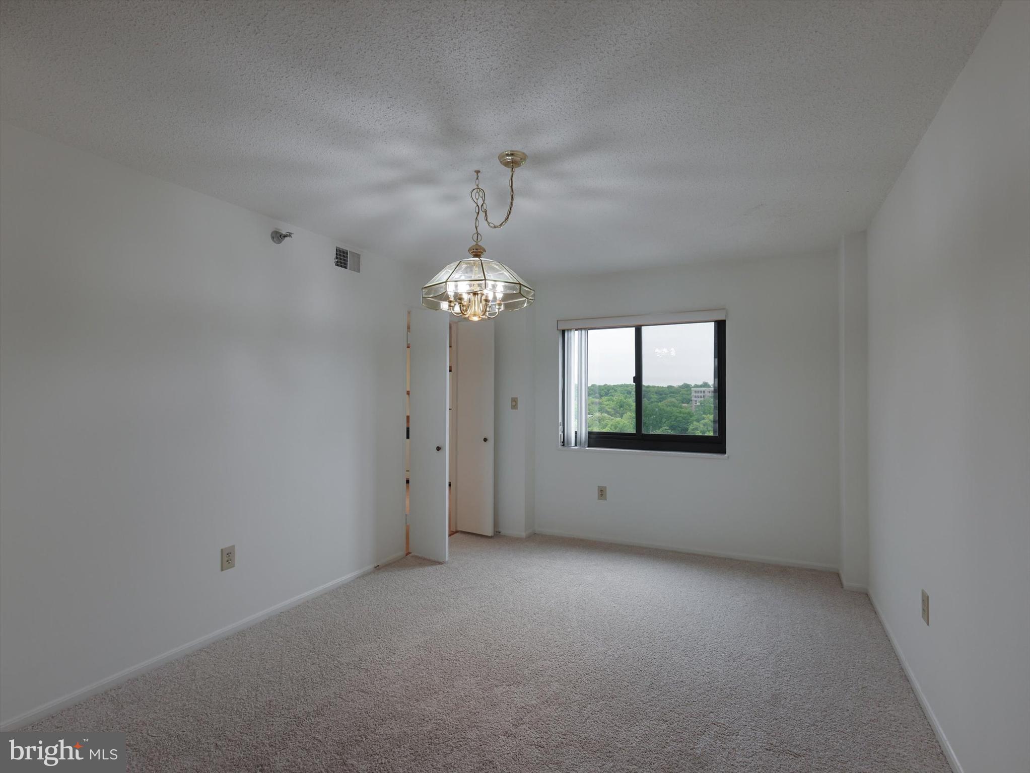 15115 Interlachen Drive, Unit 31012 Silver Spring, MD 20906 - Photo 13 of 35 a view of room with window and ceiling fan