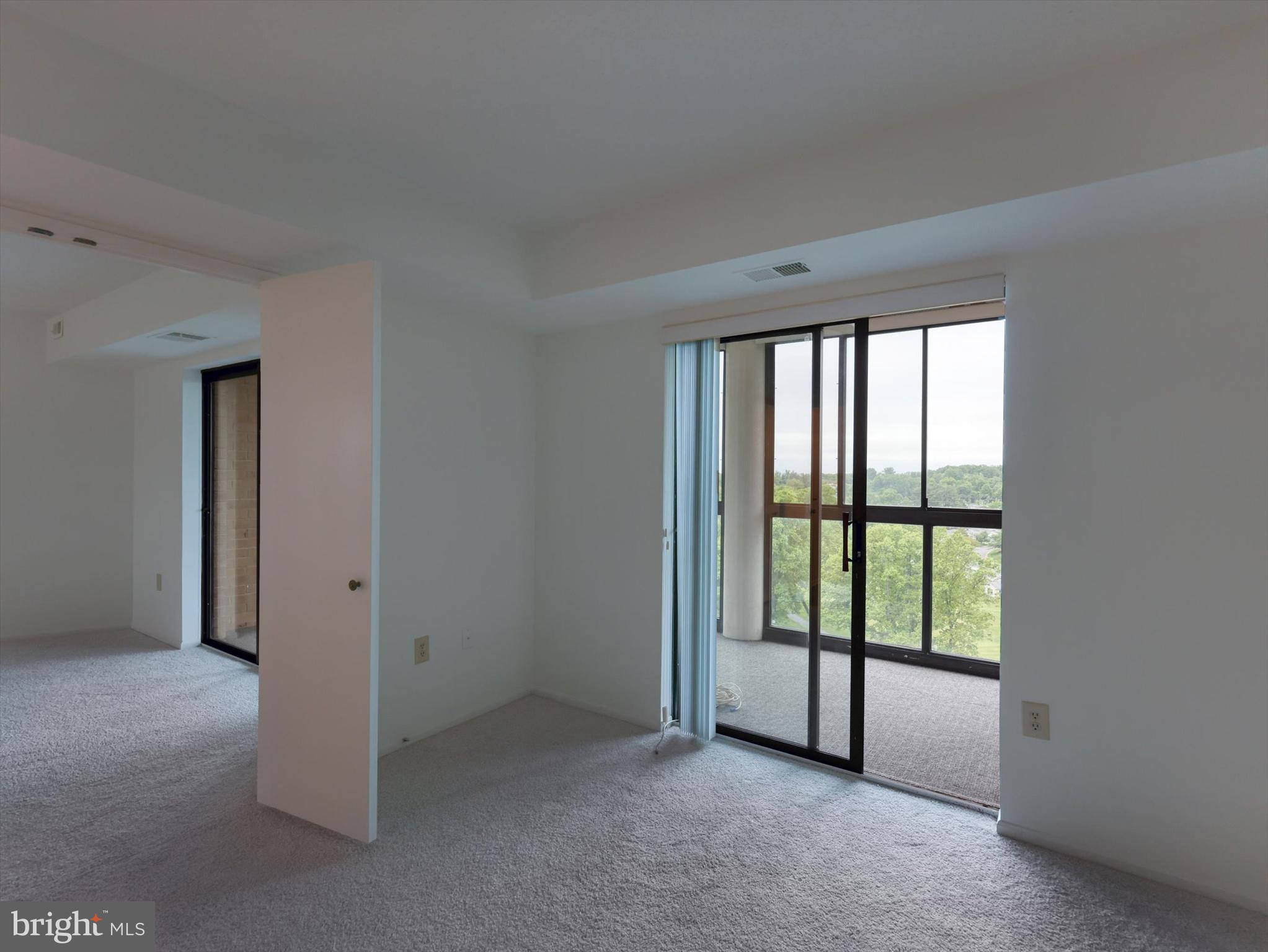 15115 Interlachen Drive, Unit 31012 Silver Spring, MD 20906 - Photo 19 of 35 an empty room with windows