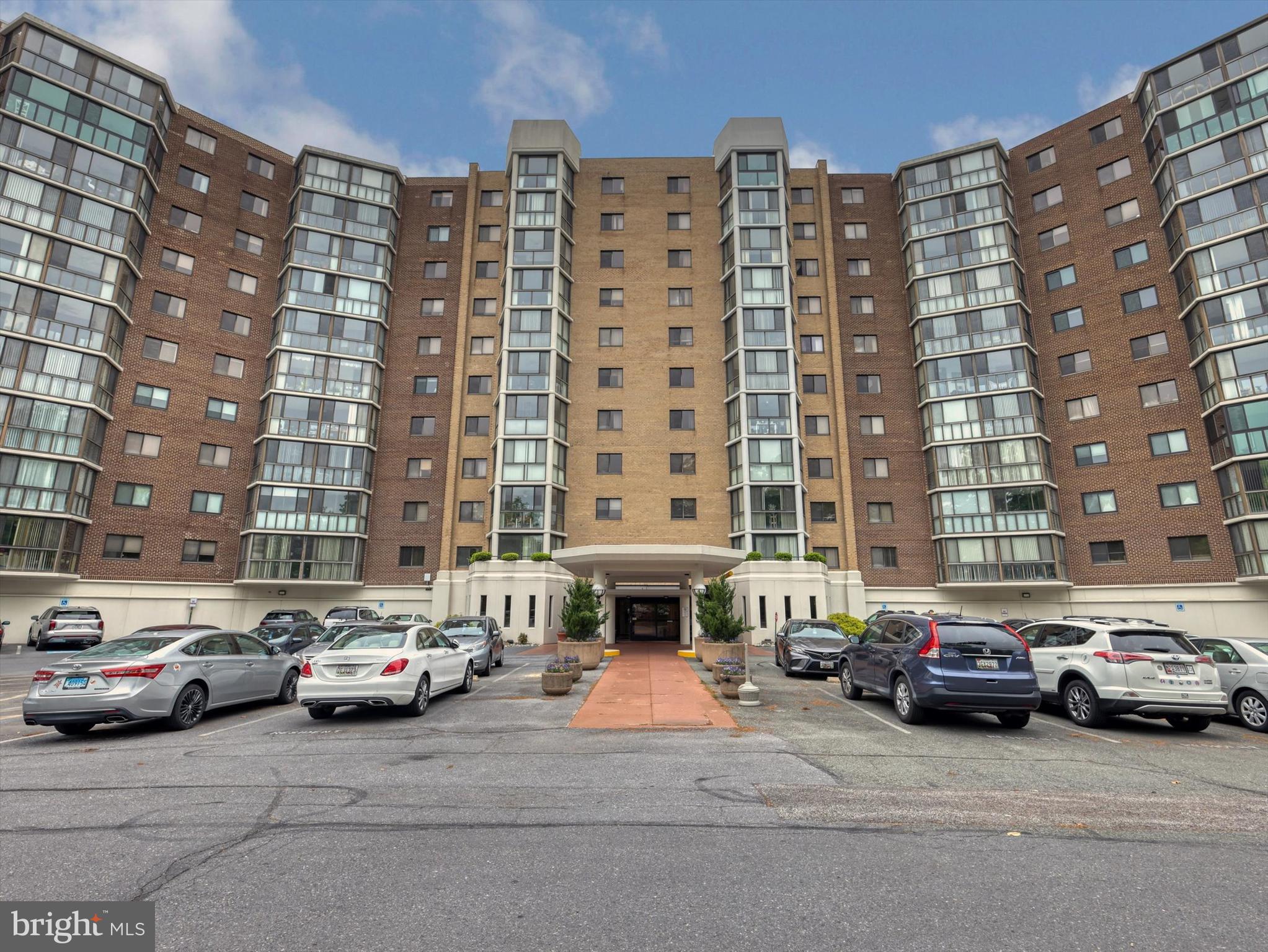 15115 Interlachen Drive, Unit 31012 Silver Spring, MD 20906 - Photo 2 of 35 a building with car parked