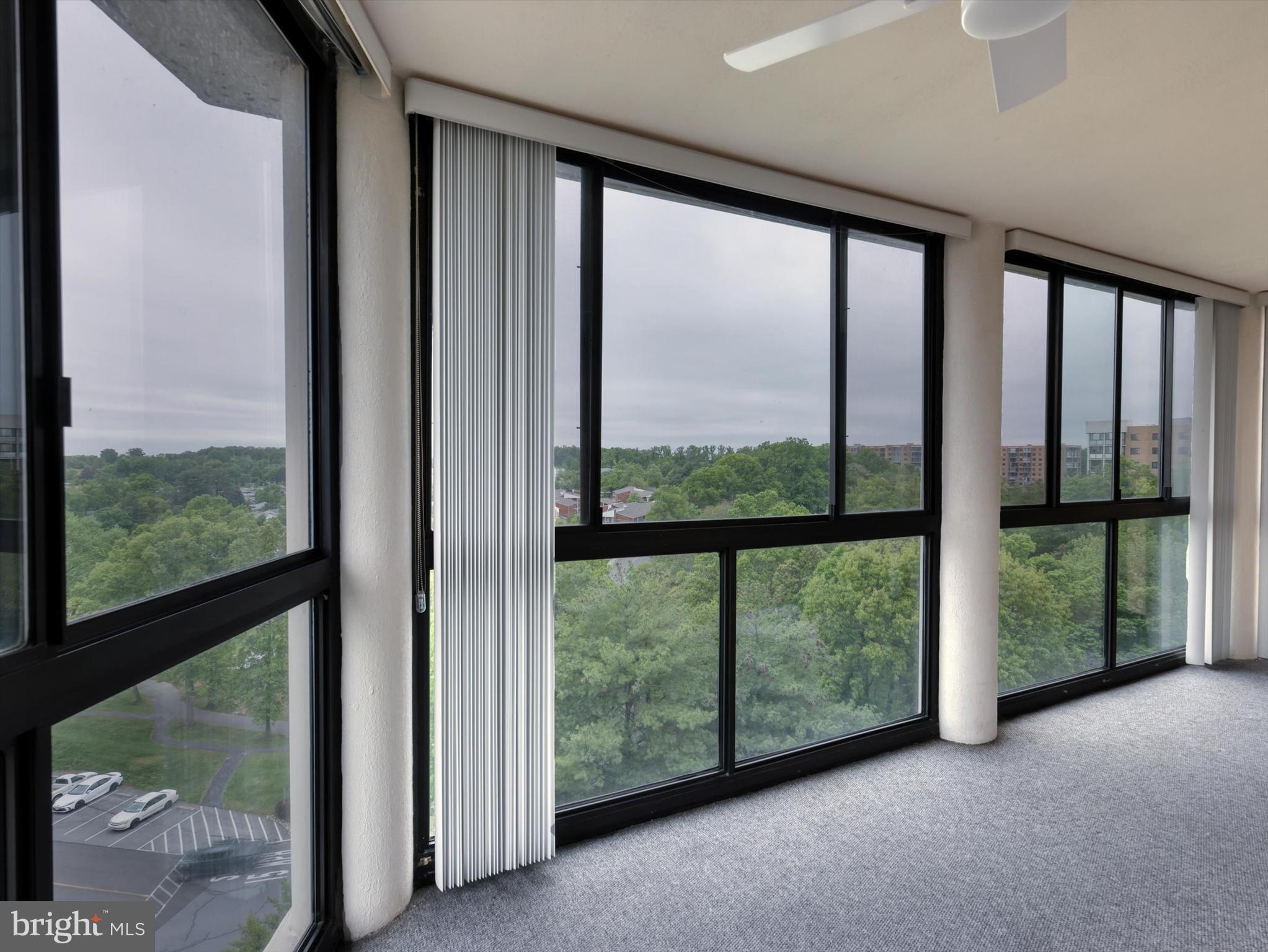 15115 Interlachen Drive, Unit 31012 Silver Spring, MD 20906 - Photo 26 of 35 a view of a room with large windows