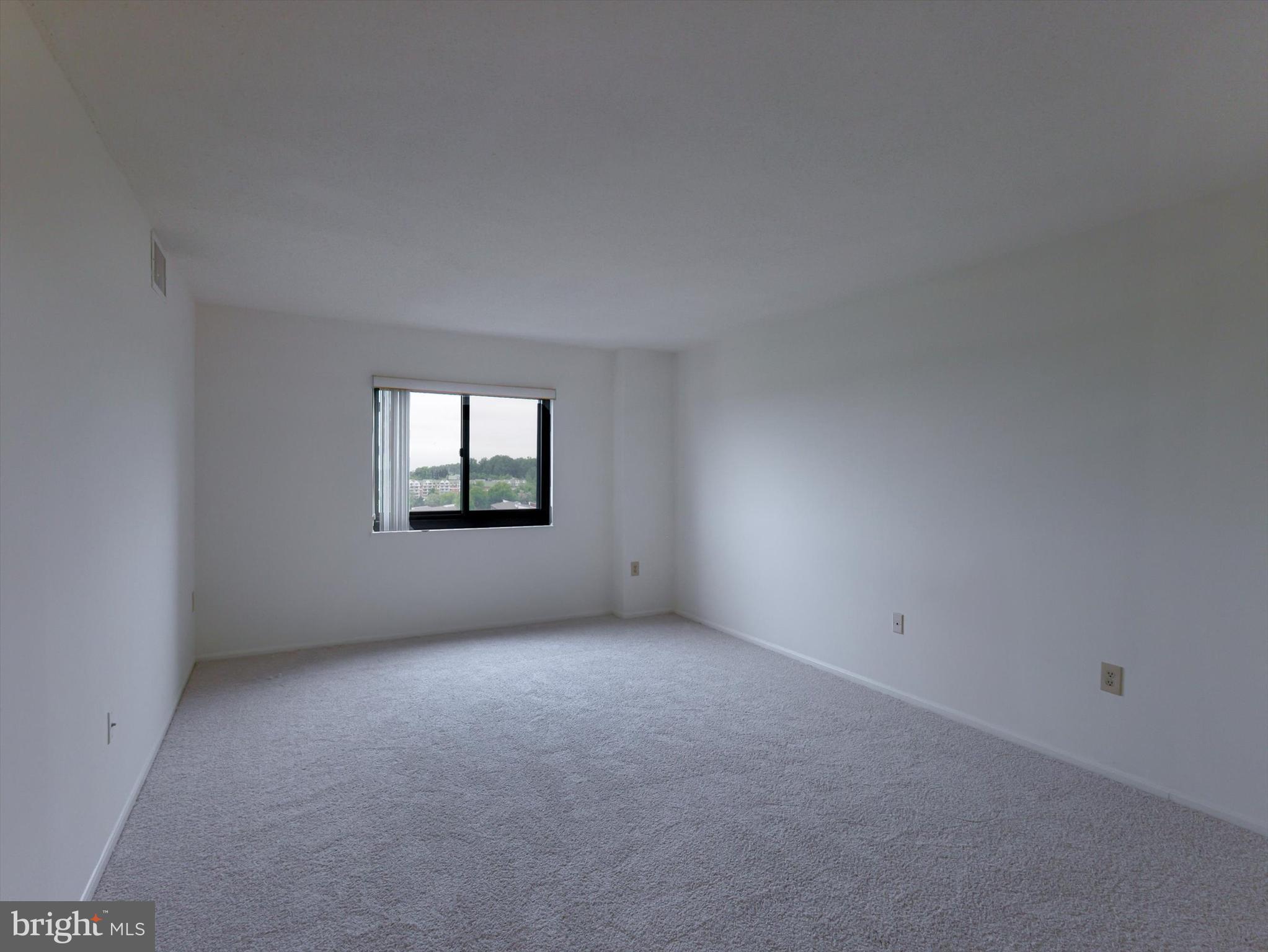 15115 Interlachen Drive, Unit 31012 Silver Spring, MD 20906 - Photo 29 of 35 a view of an empty room and window