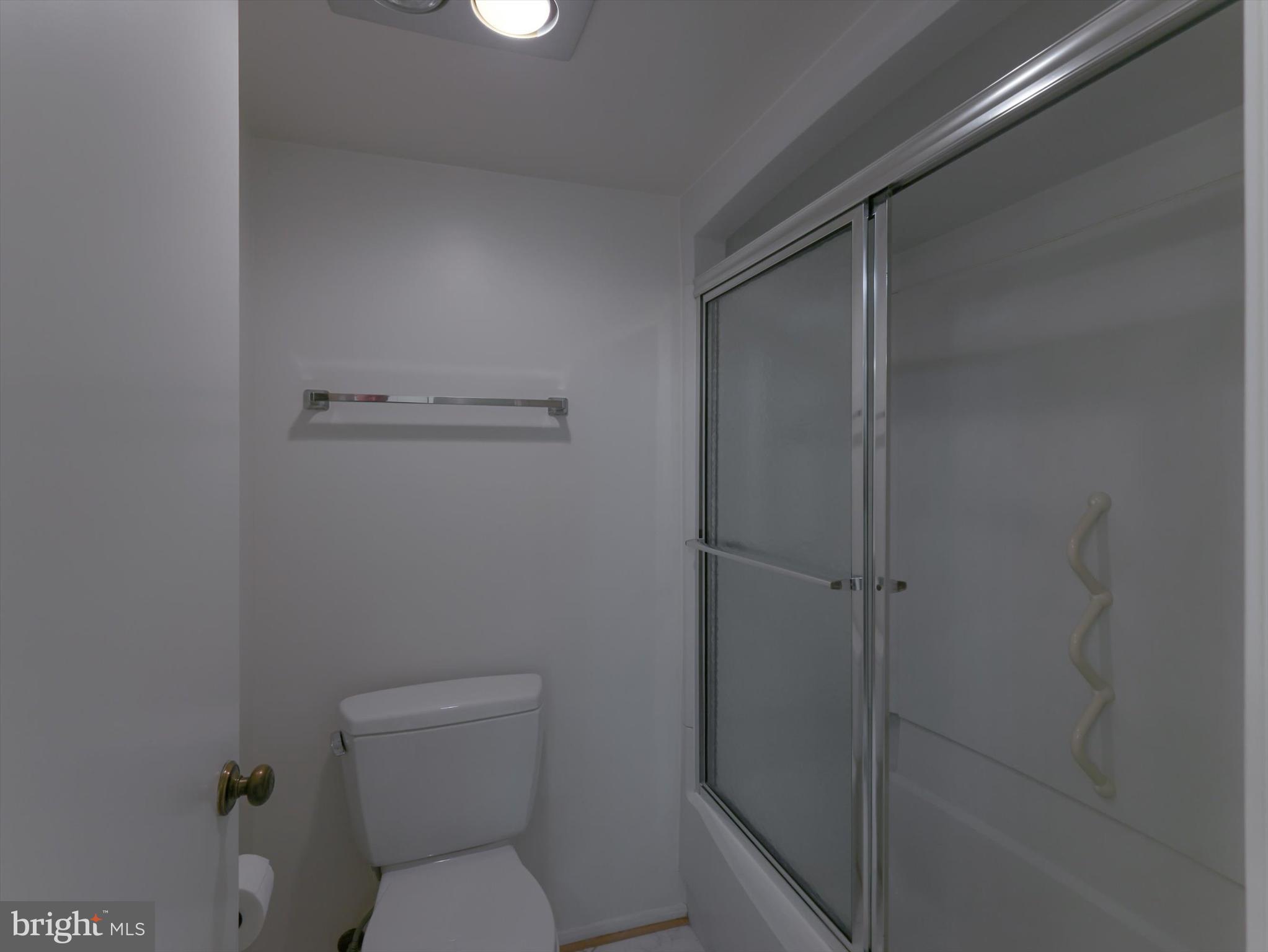 15115 Interlachen Drive, Unit 31012 Silver Spring, MD 20906 - Photo 34 of 35 a white toilet sitting next to a shower