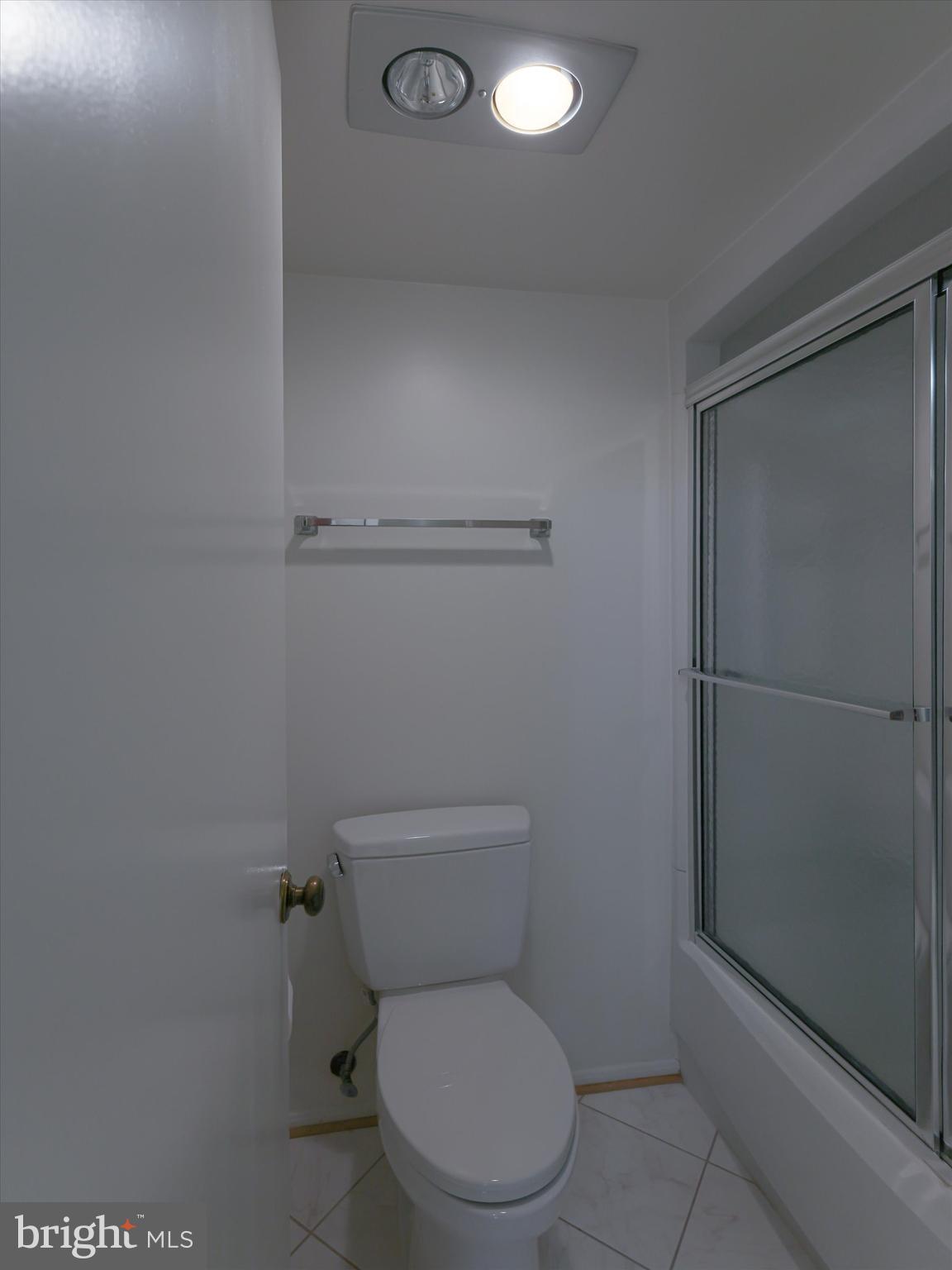 15115 Interlachen Drive, Unit 31012 Silver Spring, MD 20906 - Photo 35 of 35 a white toilet sitting next to a bathroom sink