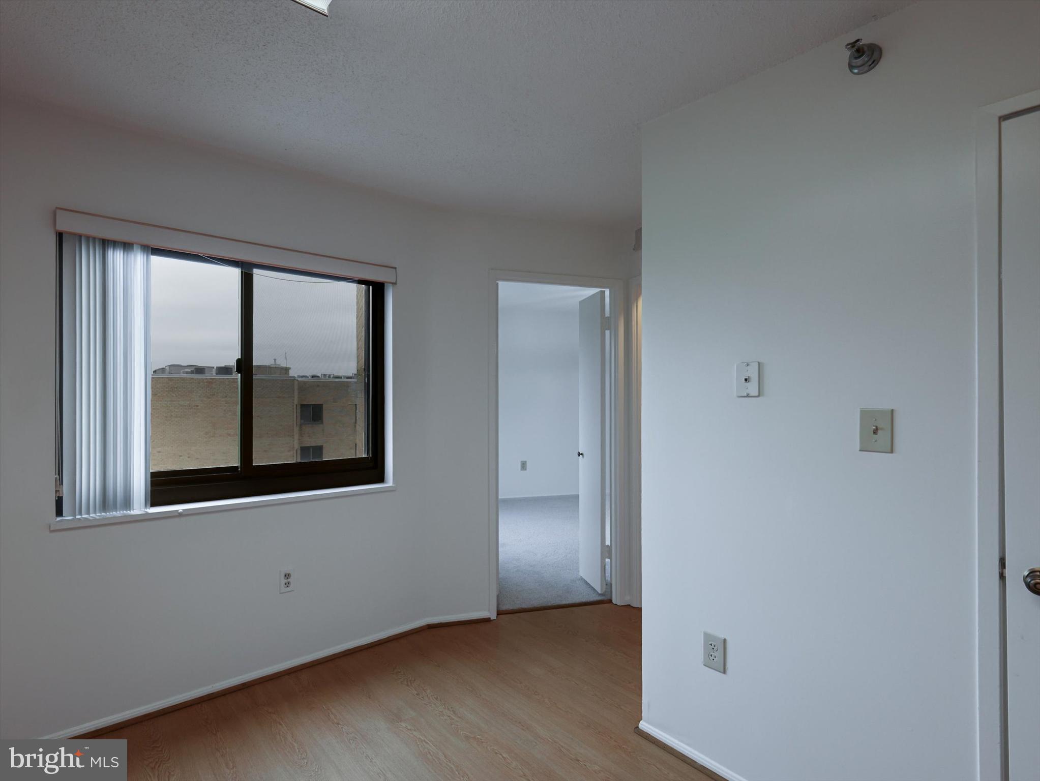 15115 Interlachen Drive, Unit 31012 Silver Spring, MD 20906 - Photo 10 of 35 an empty room with a window