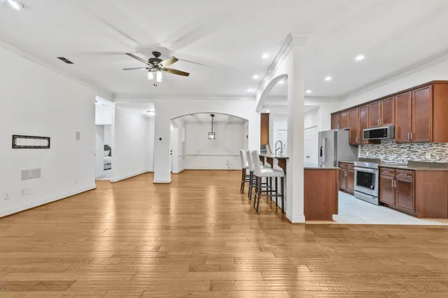 a view of kitchen with cabinets and wooden floor
