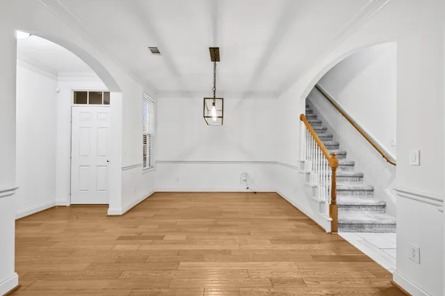 a view of a hallway with staircase