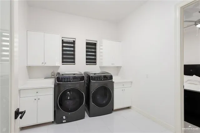 a view of a workspace with furniture and a flat screen tv