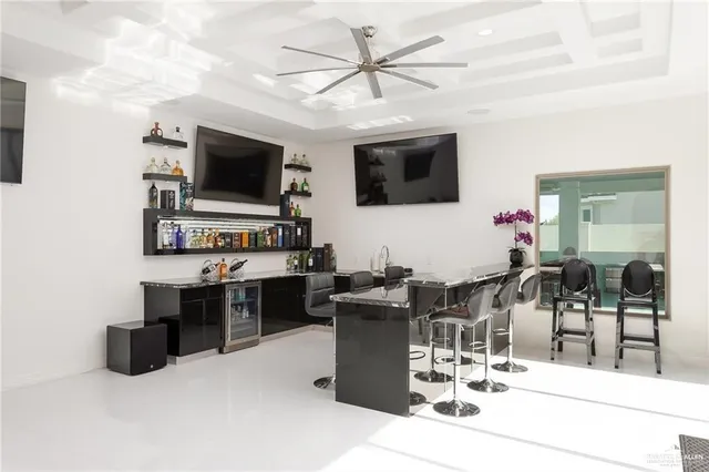 a large room with a large window and furniture