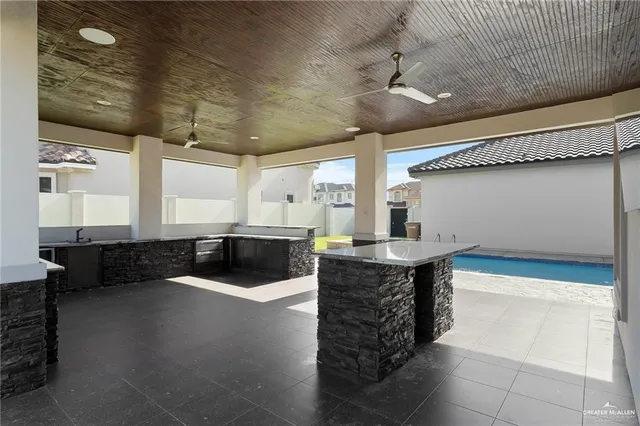 a view of outdoor space yard deck patio and outdoor kitchen