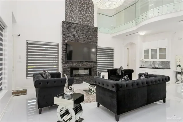 a living room with furniture and a fireplace