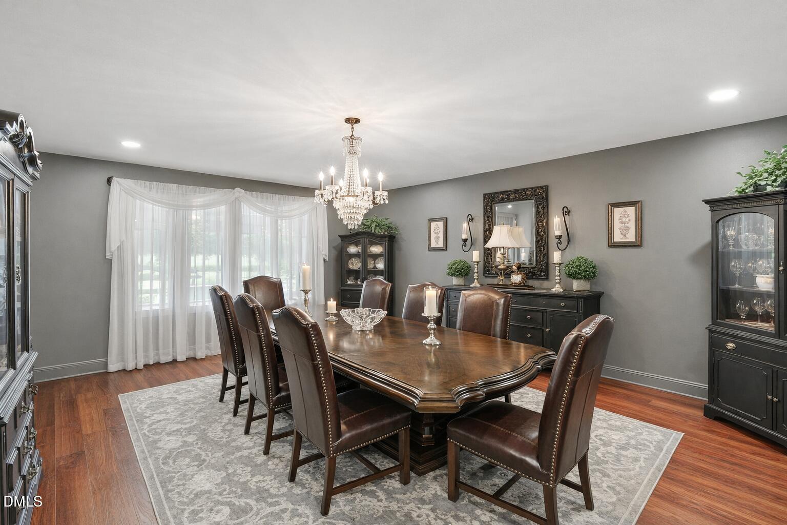 474 East Barefoot Road Newton Grove, NC 28366 - Photo 9 of 63 a view of a dining room with furniture and wooden floor