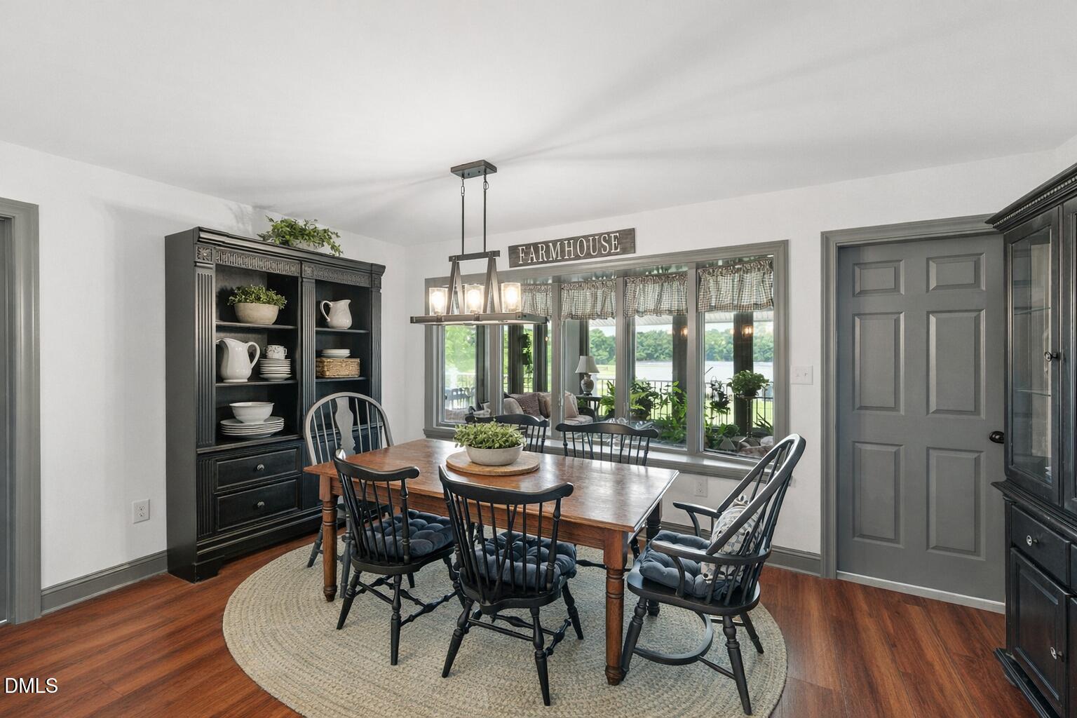 474 East Barefoot Road Newton Grove, NC 28366 - Photo 19 of 63 a view of a dining room with furniture window and wooden floor