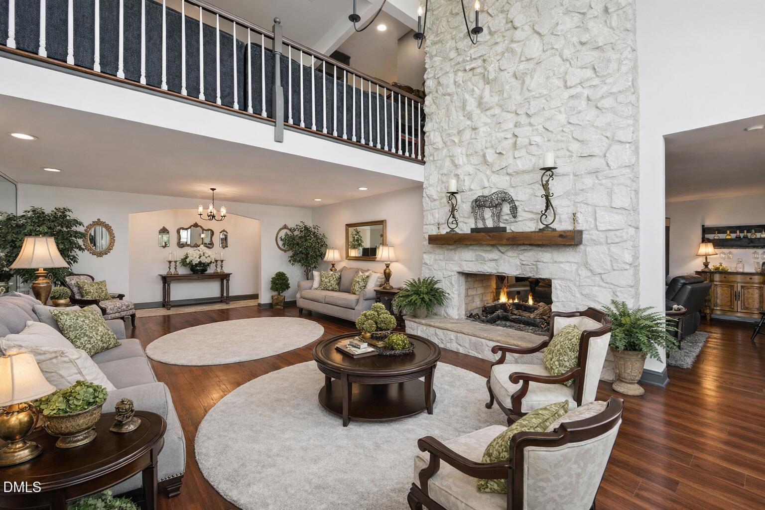 474 East Barefoot Road Newton Grove, NC 28366 - Photo 20 of 63 a living room with furniture a fireplace and a flat screen tv