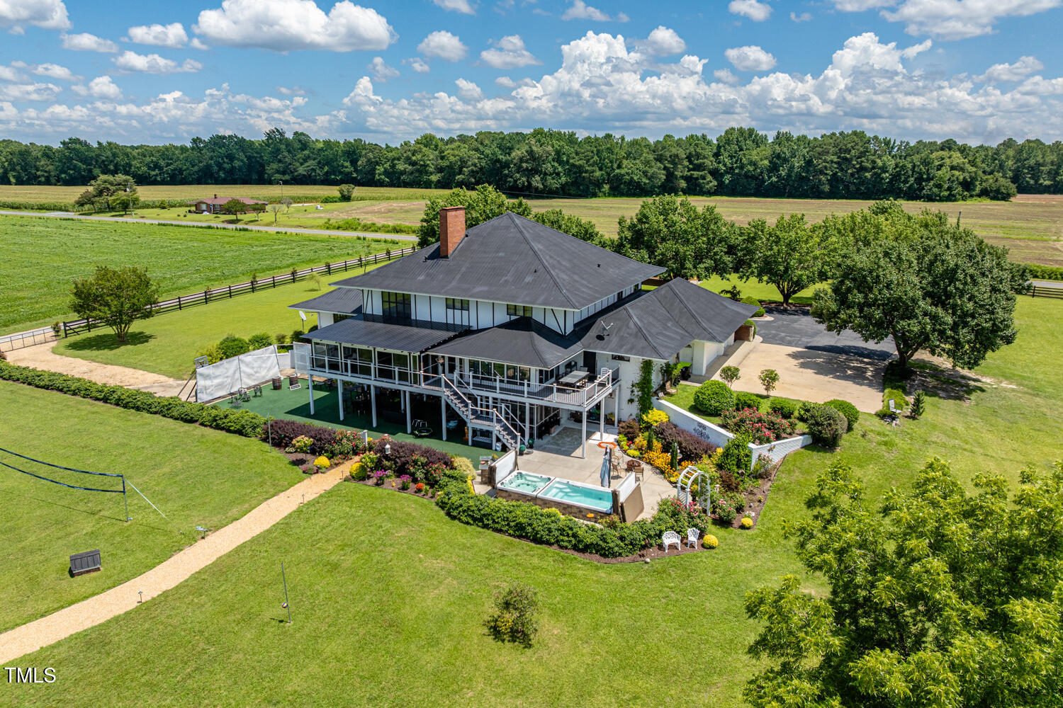 474 East Barefoot Road Newton Grove, NC 28366 - Photo 3 of 63 an aerial view of a house with a garden and lake view