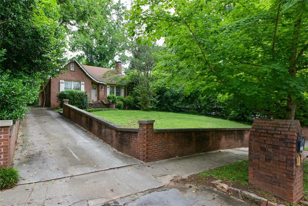 1424 Emory Road Northeast Atlanta, GA 30306 - Photo 3 of 36 a view of a house with a backyard