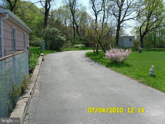 8003 Haas Lane Rosedale, MD 21237 - Photo 3 of 18 side driveway entering rear yard