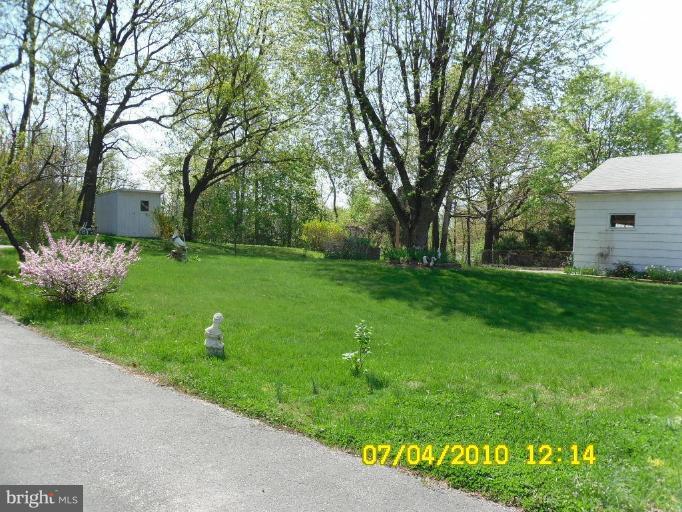 8003 Haas Lane Rosedale, MD 21237 - Photo 4 of 18 side of yard next to incoming driveway