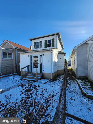 a house view with a backyard