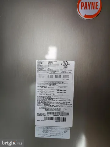 a view of staircase with white walls and a window