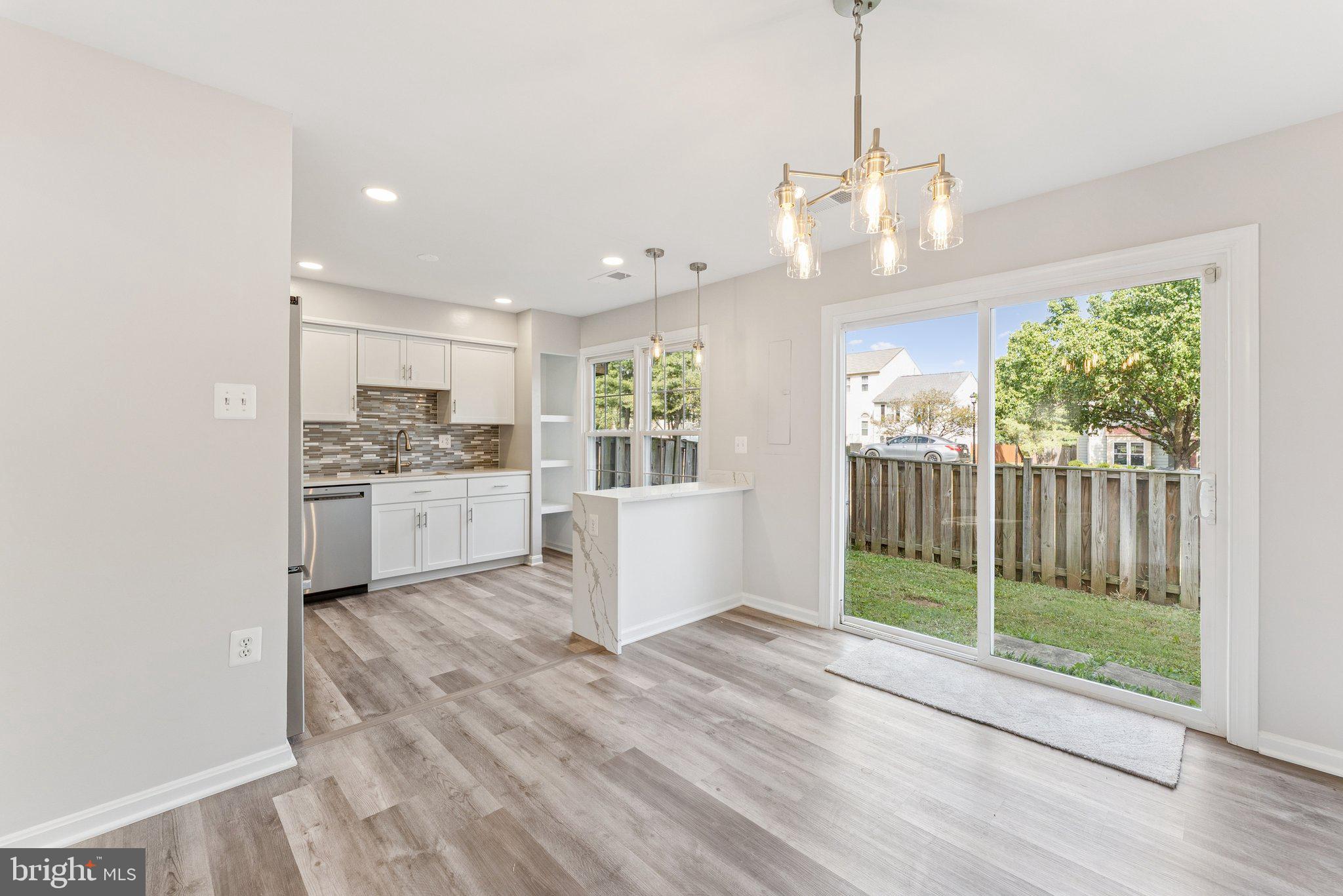 7408 Emerald Drive Manassas, VA 20109 - Photo 7 of 44 a view of kitchen with stove and cabinets