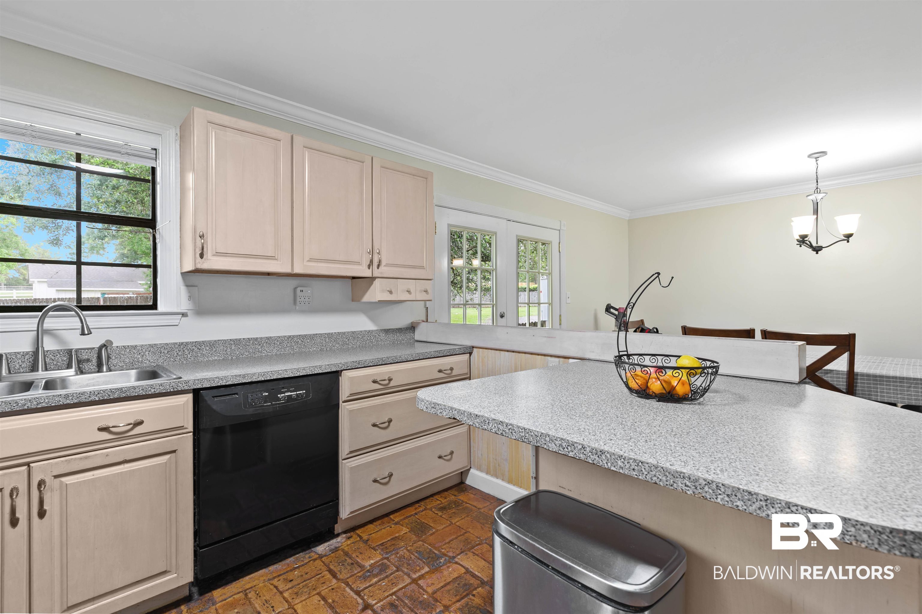 10420 Johnson Road South Mobile, AL 36695 - Photo 22 of 75 Kitchen featuring a double basin sink with a gooseneck faucet, light-colored cabinetry, a black dishwasher, and brick-style flooring