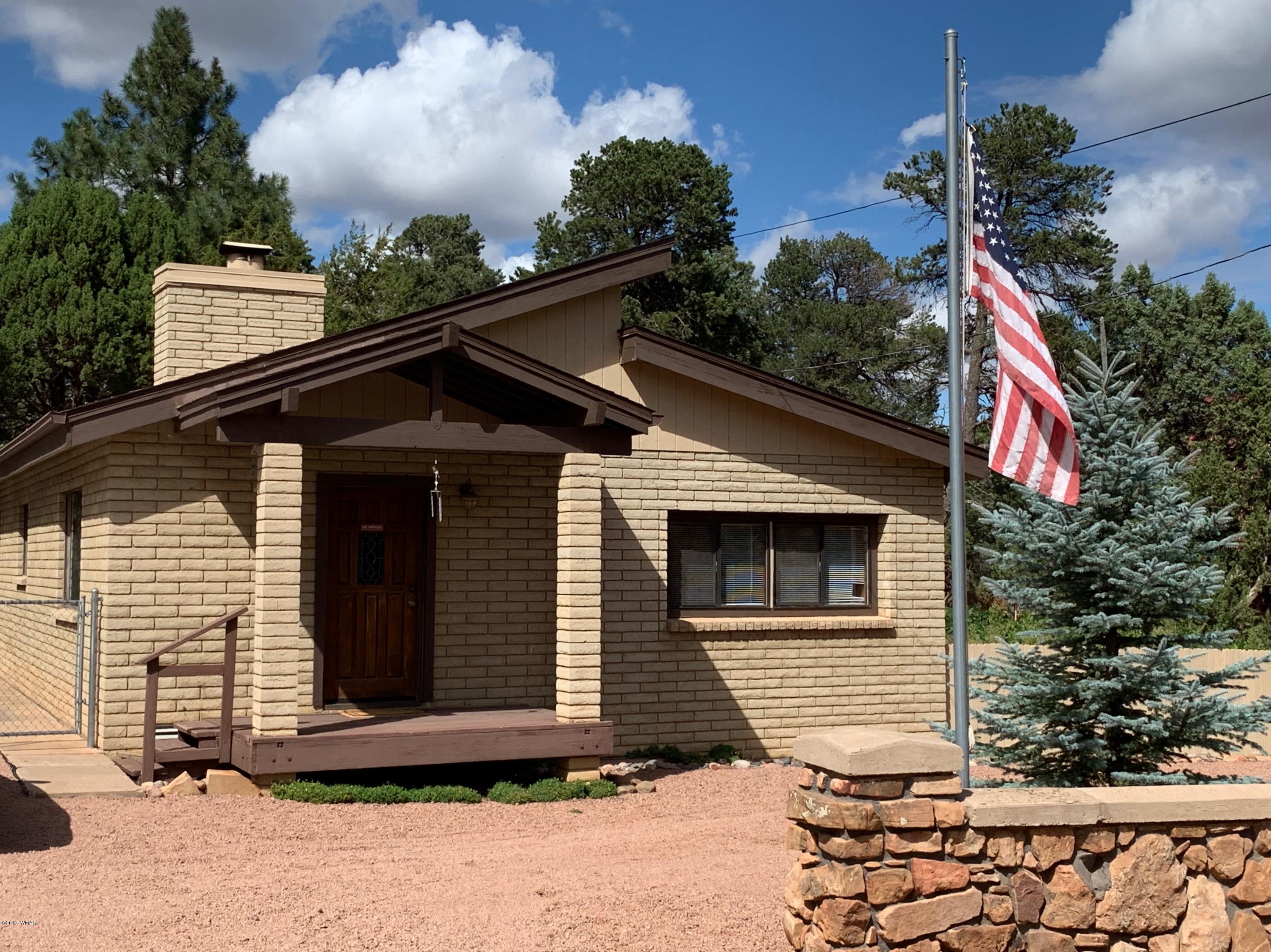 2128 Cottontail Road Overgaard, AZ 85933 - Photo 1 of 18 a front view of a house
