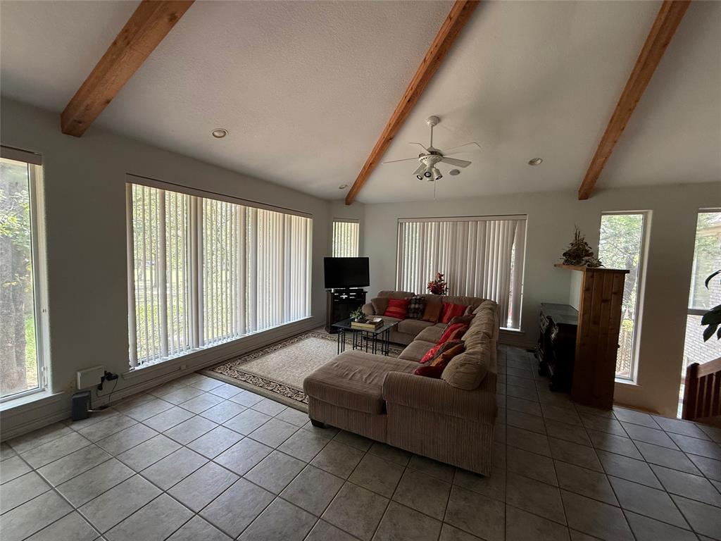 104 Pawnee Trail Gainesville, TX 76240 - Photo 15 of 30 a living room with furniture and a large window