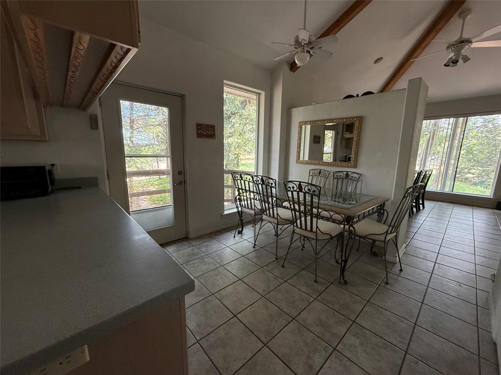 104 Pawnee Trail Gainesville, TX 76240 - Photo 17 of 30 a dining room with furniture and window