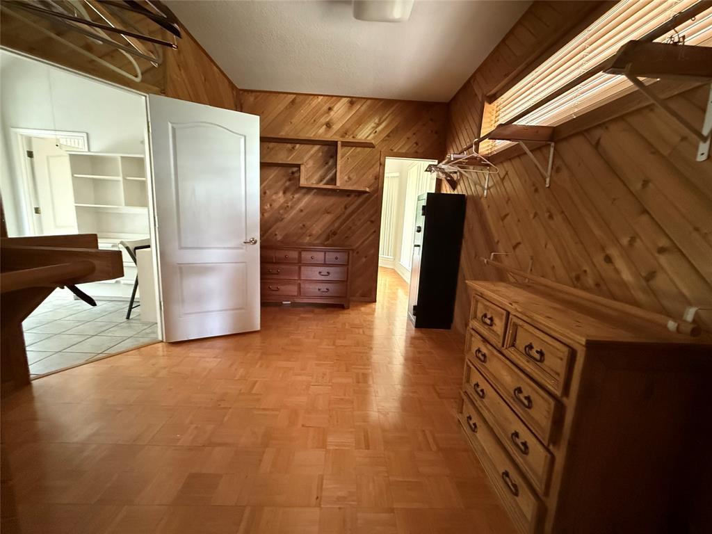 104 Pawnee Trail Gainesville, TX 76240 - Photo 20 of 30 a view of walk in closet with clothes