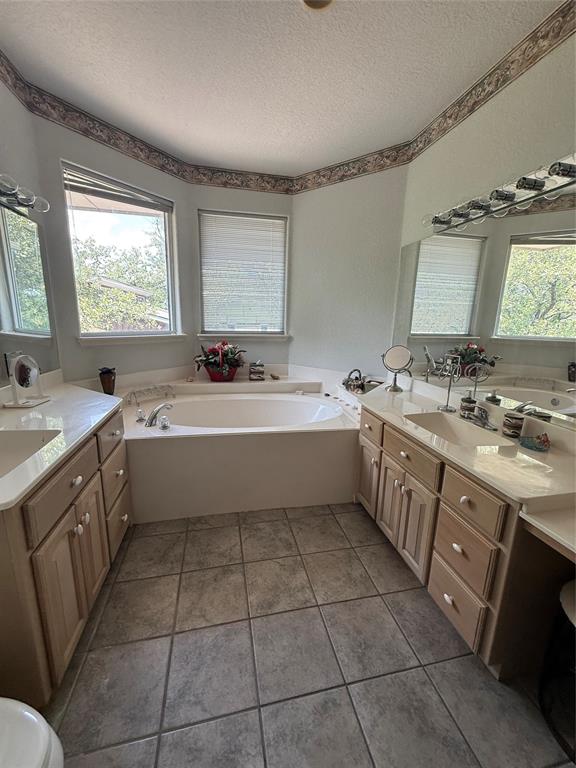 104 Pawnee Trail Gainesville, TX 76240 - Photo 21 of 30 a kitchen with a sink a stove a counter space and appliances