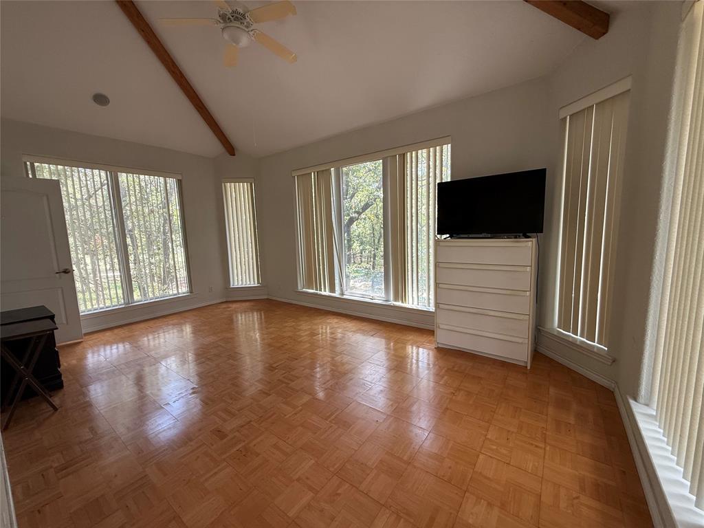 104 Pawnee Trail Gainesville, TX 76240 - Photo 23 of 30 an empty room with wooden floor and windows