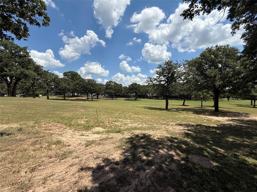 104 Pawnee Trail Gainesville, TX 76240 - Photo 29 of 30 a view of a lake with a yard