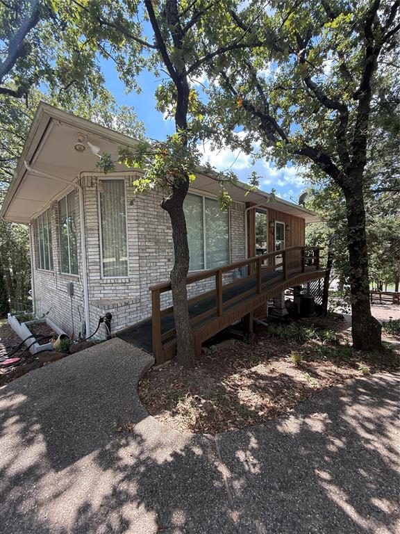 104 Pawnee Trail Gainesville, TX 76240 - Photo 30 of 30 a view of a house with a yard covered in snow