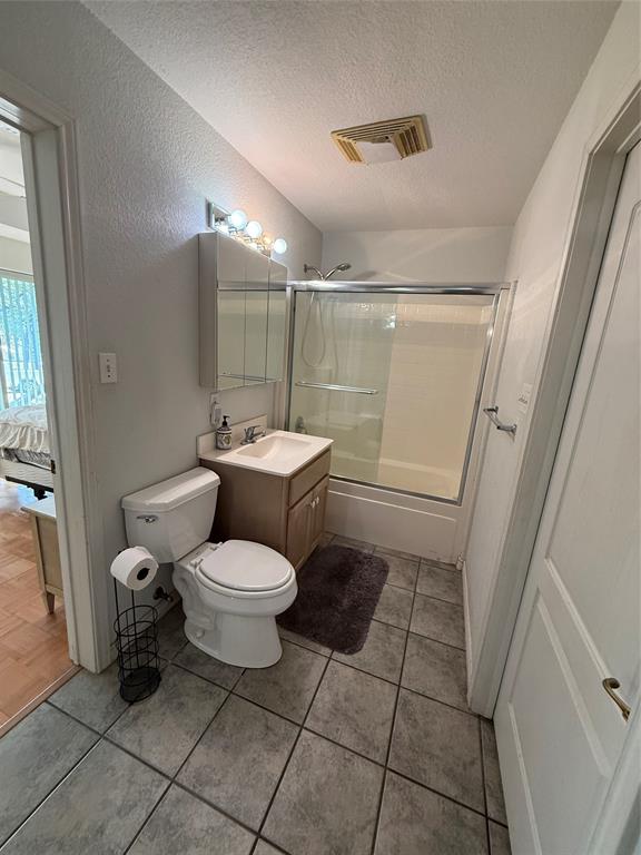 104 Pawnee Trail Gainesville, TX 76240 - Photo 7 of 30 a bathroom with a toilet a sink and a shower