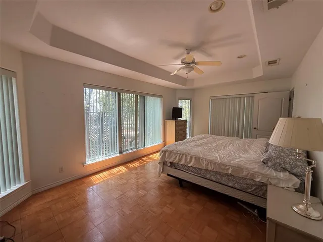 a kitchen with stainless steel appliances granite countertop white cabinets stove a sink and dishwasher
